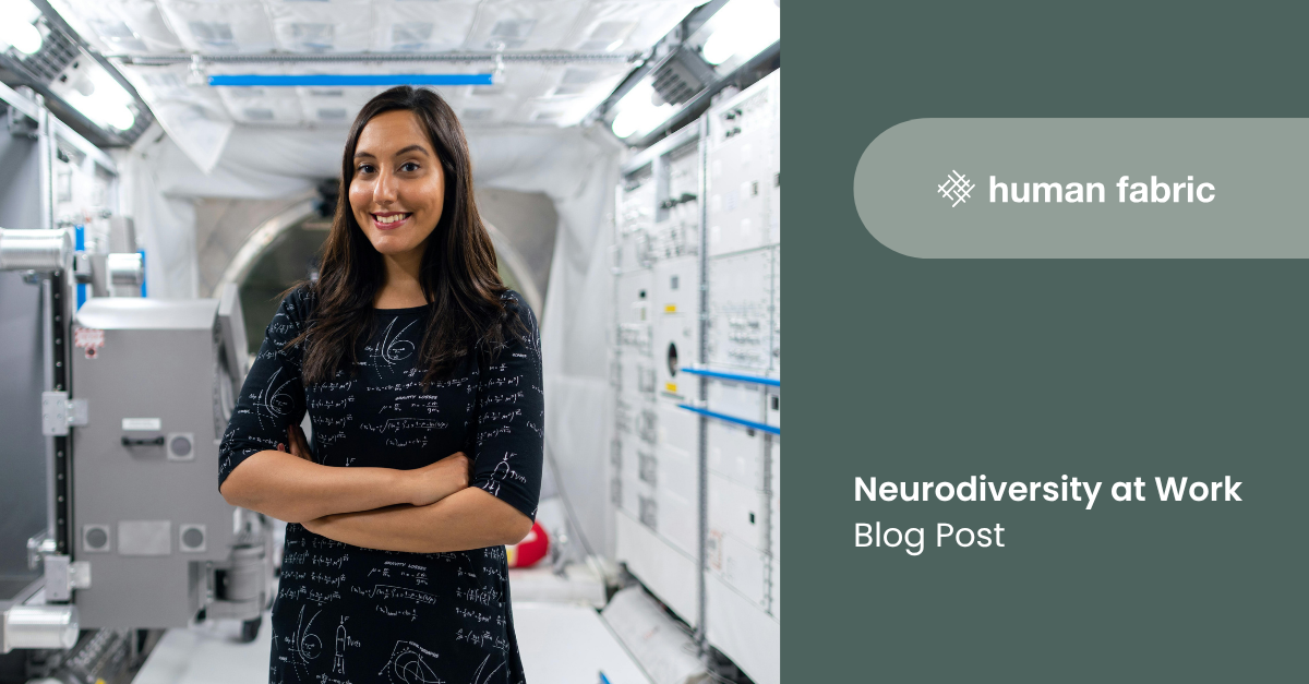 An indian female professional standing in a high tech room surrounded in equipment.