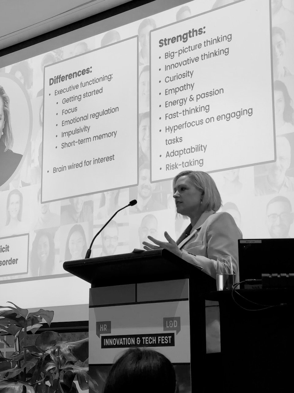 Jenny speaking at a lecturn at the HR & L&D innovation and tech fest